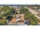 Aerial view of the property and neighborhood, showing the backyard with a fire pit at 1117 Tyrone N Blvd, St Petersburg, FL 33710