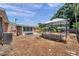 Spacious backyard with a gazebo, wood mulch ground cover, and lush foliage creating a private outdoor oasis at 1117 Tyrone N Blvd, St Petersburg, FL 33710