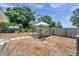 Expansive backyard with a charming gazebo, fire pit, and lush landscaping creating a serene outdoor space at 1117 Tyrone N Blvd, St Petersburg, FL 33710