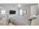 Bright bedroom features a large dresser, neutral walls and floors, offering a serene and comfortable space at 1117 Tyrone N Blvd, St Petersburg, FL 33710