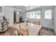 Cozy dining area with a table, four chairs, and natural light through the windows; room with modern style decor at 1117 Tyrone N Blvd, St Petersburg, FL 33710