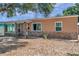 Single-story home with a combination of brick and stucco, complemented by a tidy front yard at 1117 Tyrone N Blvd, St Petersburg, FL 33710