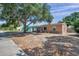 Street view of a well-kept home with mature trees offering shade in a suburban setting at 1117 Tyrone N Blvd, St Petersburg, FL 33710