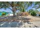 Cozy home featuring stucco and brick exterior, surrounded by mature trees and a tidy yard at 1117 Tyrone N Blvd, St Petersburg, FL 33710