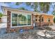 Charming single-story home with brick accents, large windows, and well-maintained landscaping at 1117 Tyrone N Blvd, St Petersburg, FL 33710