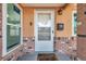 Close-up of the home's entrance, showing a charming front door and brick detailing at 1117 Tyrone N Blvd, St Petersburg, FL 33710