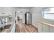 Modern kitchen with granite countertops, updated appliances, and white cabinets at 1117 Tyrone N Blvd, St Petersburg, FL 33710