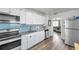 Updated kitchen boasting granite countertops, stainless steel appliances, and white cabinetry at 1117 Tyrone N Blvd, St Petersburg, FL 33710