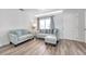 Inviting living room with modern decor, featuring light-colored furniture and hardwood floors at 1117 Tyrone N Blvd, St Petersburg, FL 33710