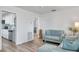 Bright living room with hardwood floors, contemporary furniture, and an open layout at 1117 Tyrone N Blvd, St Petersburg, FL 33710