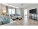 Comfortable living space with hardwood floors, soft lighting, and stylish furnishings at 1117 Tyrone N Blvd, St Petersburg, FL 33710