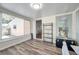 Sunroom featuring large windows and modern wood flooring at 1117 Tyrone N Blvd, St Petersburg, FL 33710