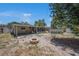 Large backyard with a pool, fire pit, and a screened-in patio area at 11486 92Nd N St, Largo, FL 33773
