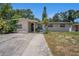 Inviting single-Gathering home with a well-lit entry, fresh paint, and a neatly maintained front lawn at 11486 92Nd N St, Largo, FL 33773