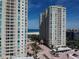 Gorgeous view of luxurious high-rise buildings near a pristine beach with inviting turquoise waters and manicured landscaping at 1180 Gulf Blvd # 306, Clearwater, FL 33767