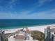 Breathtaking aerial view of beachfront property, featuring white sandy beaches and luxurious high-rise buildings at 1180 Gulf Blvd # 306, Clearwater, FL 33767