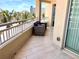 Cozy condo balcony with cushioned outdoor seating and lovely views at 1180 Gulf Blvd # 306, Clearwater, FL 33767