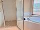 Bright bathroom featuring dual sinks, tiled shower and large soaking tub at 1180 Gulf Blvd # 306, Clearwater, FL 33767