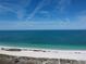 Scenic beach view showcasing the white sands, turquoise waters, and clear blue sky, highlighting the coastal charm at 1180 Gulf Blvd # 306, Clearwater, FL 33767