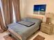 Sunlit bedroom featuring soft neutral tones, and decorative rug accents at 1180 Gulf Blvd # 306, Clearwater, FL 33767