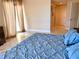 Comfortable bedroom with stylish headboard and blue comforter with plenty of natural light at 1180 Gulf Blvd # 306, Clearwater, FL 33767