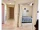 Cozy bedroom featuring ceiling fan and gray bedding at 1180 Gulf Blvd # 306, Clearwater, FL 33767