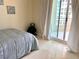Serene bedroom with comfortable bedding and lots of natural light at 1180 Gulf Blvd # 306, Clearwater, FL 33767