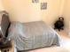 Well-lit bedroom with a comfortable bed and minimalist decor for a relaxing retreat at 1180 Gulf Blvd # 306, Clearwater, FL 33767