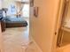 Spacious primary bedroom featuring marble floors, a king bed, and ensuite bath at 1180 Gulf Blvd # 306, Clearwater, FL 33767