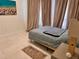 Calm bedroom featuring large windows, neutral tones, and comfortable furniture at 1180 Gulf Blvd # 306, Clearwater, FL 33767