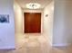 Charming entryway featuring stone floors and double doors at 1180 Gulf Blvd # 306, Clearwater, FL 33767