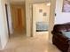 Open hallway leading to a bedroom featuring neutral tones and comfortable furniture at 1180 Gulf Blvd # 306, Clearwater, FL 33767