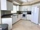 Bright kitchen with white cabinetry, modern appliances, and a sleek design at 1180 Gulf Blvd # 306, Clearwater, FL 33767