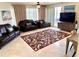 Inviting living room with sofas, stylish rug, and sliding doors at 1180 Gulf Blvd # 306, Clearwater, FL 33767