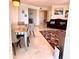 Large living room featuring a dining area, marble floors, and a leather couch at 1180 Gulf Blvd # 306, Clearwater, FL 33767
