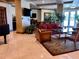 Comfortable lounge area with cozy seating, large windows, and stylish decor at 1180 Gulf Blvd # 306, Clearwater, FL 33767