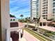 Stunning view of the beach, landscaping, and main building at 1180 Gulf Blvd # 306, Clearwater, FL 33767