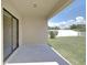Covered back patio with view of the backyard, perfect for outdoor relaxation and entertainment at 1210 Harbour Blue St, Ruskin, FL 33570