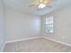 Comfortable bedroom featuring neutral paint, carpeted floors, and a window for natural light at 1210 Harbour Blue St, Ruskin, FL 33570