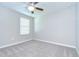 Bright bedroom with neutral carpet, a ceiling fan, and a window allowing natural light at 1210 Harbour Blue St, Ruskin, FL 33570