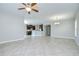 Spacious living room seamlessly connected to an open-concept kitchen, perfect for modern living at 1210 Harbour Blue St, Ruskin, FL 33570