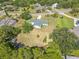 Expansive aerial view of home showcasing the surrounding landscape, trees, and community at 12220 Twin Branch Acres Rd, Tampa, FL 33626