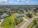 Aerial view of property boundaries and surroundings, highlighting the spacious lot and neighborhood setting at 12220 Twin Branch Acres Rd, Tampa, FL 33626
