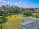 Large backyard area with mature trees offering plenty of space for outdoor activities and privacy at 12220 Twin Branch Acres Rd, Tampa, FL 33626