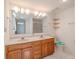 Bright bathroom featuring a large double vanity, tile floors, and a walk-in shower at 12220 Twin Branch Acres Rd, Tampa, FL 33626