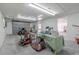 Well-lit garage featuring a roll-up door and abundant space for vehicles and storage solutions at 12220 Twin Branch Acres Rd, Tampa, FL 33626