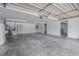 Large garage with high ceilings, laundry area, and plenty of open space at 12220 Twin Branch Acres Rd, Tampa, FL 33626