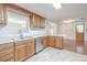 This kitchen features wood cabinets, stainless steel appliances, and a breakfast bar at 12220 Twin Branch Acres Rd, Tampa, FL 33626