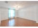 Living room showcasing light, complemented by well-maintained wood flooring at 12220 Twin Branch Acres Rd, Tampa, FL 33626