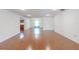 Spacious living room featuring wood flooring and ample natural light at 12220 Twin Branch Acres Rd, Tampa, FL 33626